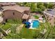 Wonderful backyard with a sparkling pool, spa, hammock, covered patio, and luscious landscaping at 3760 W Lapenna Dr, New River, AZ 85087