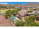 Wonderful backyard with a sparkling pool, spa, hammock, covered patio, and luscious landscaping at 3760 W Lapenna Dr, New River, AZ 85087