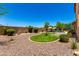 Large backyard with an artificial turf putting green, desert landscaping, and a charming outdoor living space at 3760 W Lapenna Dr, New River, AZ 85087