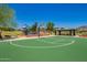 Community basketball court includes shaded picnic tables and a green court, great for outdoor recreation at 3760 W Lapenna Dr, New River, AZ 85087