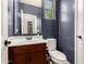 Stylish powder room boasts a pedestal sink, wood vanity, updated fixtures, and modern design at 3760 W Lapenna Dr, New River, AZ 85087