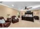 This is a primary bedroom with with comfortable seating and a connecting primary bathroom at 3760 W Lapenna Dr, New River, AZ 85087