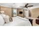 This bedroom offers large windows and tan walls with a ceiling fan at 3760 W Lapenna Dr, New River, AZ 85087