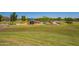 Expansive community park with playground, basketball court, lush greenery, and inviting spaces for relaxation at 3760 W Lapenna Dr, New River, AZ 85087