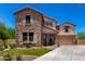 Charming two-story home featuring stone accents, a covered porch and a two car garage at 3760 W Lapenna Dr, New River, AZ 85087