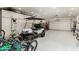 Garage featuring a golf cart, bikes and storage cabinets at 3760 W Lapenna Dr, New River, AZ 85087