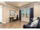 Cozy home office featuring wood floors, a comfortable sofa, and lots of natural light at 3760 W Lapenna Dr, New River, AZ 85087