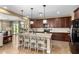 Spacious kitchen featuring a large island, granite countertops and stainless steel appliances at 3760 W Lapenna Dr, New River, AZ 85087