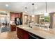 Spacious kitchen featuring a large island, granite countertops and stainless steel appliances at 3760 W Lapenna Dr, New River, AZ 85087