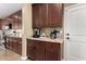 This kitchen features wood cabinets, granite counters, stainless appliances, and coffee bar at 3760 W Lapenna Dr, New River, AZ 85087