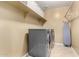 Laundry room featuring a washer, dryer, overhead shelving and ironing board at 3760 W Lapenna Dr, New River, AZ 85087