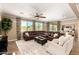 Spacious living room featuring large windows, plush seating, and neutral décor for a welcoming atmosphere at 3760 W Lapenna Dr, New River, AZ 85087