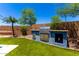 Outdoor kitchen with gas grill and granite countertops at 3760 W Lapenna Dr, New River, AZ 85087