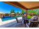 Inviting backyard featuring a pool, patio seating and a built in BBQ at 3760 W Lapenna Dr, New River, AZ 85087