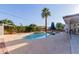 An inviting pool area is enhanced by a towering palm tree, providing shade and beauty to the outdoor space at 4117 E Coolidge St, Phoenix, AZ 85018