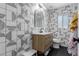 Stylish bathroom showcasing a vanity, toilet, and modern tile backsplash at 4117 E Coolidge St, Phoenix, AZ 85018