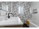 Modern bathroom featuring black hardware, decorative tile, and a built-in shower niche at 4117 E Coolidge St, Phoenix, AZ 85018