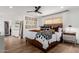 Bright bedroom with wood flooring, comfortable bedding, and stylish decor at 4117 E Coolidge St, Phoenix, AZ 85018