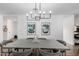 Elegant dining room with modern chandelier, stylish chairs, and contemporary artwork at 4117 E Coolidge St, Phoenix, AZ 85018
