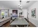 Open dining room features modern lighting, stylish furniture, and hardwood floors at 4117 E Coolidge St, Phoenix, AZ 85018