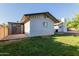 A shed with double doors with a well-maintained lawn at 4117 E Coolidge St, Phoenix, AZ 85018