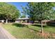Charming single-story home with well-maintained lawn and mature trees at 4117 E Coolidge St, Phoenix, AZ 85018