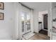 Hallway featuring a decorative shelf and a view into the bathroom and backyard at 4117 E Coolidge St, Phoenix, AZ 85018
