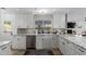 Bright kitchen features white cabinets, stainless appliances, and stylish backsplash at 4117 E Coolidge St, Phoenix, AZ 85018