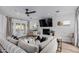 Bright living room featuring a fireplace, recessed lighting, ceiling fan, and access to the backyard at 4117 E Coolidge St, Phoenix, AZ 85018