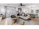 Open-concept living room with hardwood floors, modern décor, and a view into the dining area at 4117 E Coolidge St, Phoenix, AZ 85018