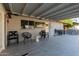 Large covered patio featuring outdoor seating, a built-in grill, and tile flooring at 4117 E Coolidge St, Phoenix, AZ 85018