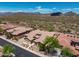 Beautiful aerial view of a desert home with lush landscaping and mountain views at 41809 N La Crosse Trl, Anthem, AZ 85086