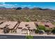 Stunning aerial view of a home with desert landscaping and mountain backdrop at 41809 N La Crosse Trl, Anthem, AZ 85086