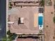 Overhead aerial shot of a house with a backyard pool, spa, and desert landscaping at 41809 N La Crosse Trl, Anthem, AZ 85086