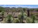 Backyard desert landscaping with cacti, plants, and mountain views beyond the fence at 41809 N La Crosse Trl, Anthem, AZ 85086