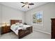 Cozy bedroom with carpet, ceiling fan, and shuttered windows offering plenty of natural light at 41809 N La Crosse Trl, Anthem, AZ 85086