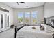 Bright bedroom features three large windows and a door leading to a private outdoor area at 41809 N La Crosse Trl, Anthem, AZ 85086