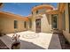 Attractive courtyard with decorative inlaid tile, planters, and stone accents at 41809 N La Crosse Trl, Anthem, AZ 85086