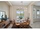 Formal dining area with natural light, stylish light fixture, and seating for six at 41809 N La Crosse Trl, Anthem, AZ 85086