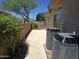 Exterior side view with AC units, desert landscaping, and a fenced yard for privacy at 41809 N La Crosse Trl, Anthem, AZ 85086