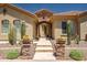 Inviting front entrance with desert landscaping, stone accents, and tiled walkway leading to the front door at 41809 N La Crosse Trl, Anthem, AZ 85086
