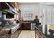 Well-equipped kitchen showcasing granite countertops, stainless steel appliances, and custom cabinets at 41809 N La Crosse Trl, Anthem, AZ 85086