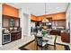 Spacious eat-in kitchen with stainless steel appliances, custom cabinets, and breakfast nook at 41809 N La Crosse Trl, Anthem, AZ 85086