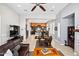 Inviting living room with a cozy seating area, open floor plan and tiled floors at 41809 N La Crosse Trl, Anthem, AZ 85086