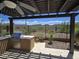 Outdoor kitchen with stainless steel grill, desert landscape, and beautiful mountain views at 41809 N La Crosse Trl, Anthem, AZ 85086