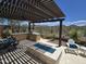Inviting outdoor kitchen and dining area with a fire pit, desert landscape, and mountain views at 41809 N La Crosse Trl, Anthem, AZ 85086