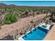 Backyard pool with spa and desert landscape providing privacy and relaxation at 41809 N La Crosse Trl, Anthem, AZ 85086