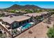 Aerial view of backyard pool, patio, and desert landscaping at 41809 N La Crosse Trl, Anthem, AZ 85086