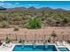 Beautiful backyard pool area with desert landscape providing serene views and privacy at 41809 N La Crosse Trl, Anthem, AZ 85086