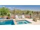 Relaxing pool and spa area with desert landscaping and mountain views in the background at 41809 N La Crosse Trl, Anthem, AZ 85086